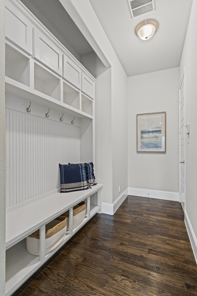 309 Red River Cir Trail, Highland Village, TX 75077 - mudroom featuring dark wood-style flooring and baseboards