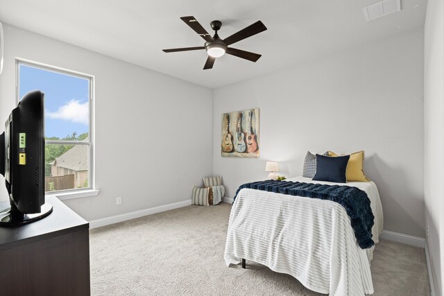 309 Red River Cir Trail, Highland Village, TX 75077 - carpeted bedroom with baseboards and ceiling fan