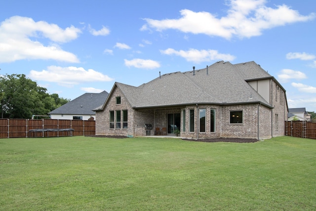 309 Red River Cir Trail, Highland Village, TX 75077 - back of house featuring a fenced backyard, brick siding, and roof with shingles