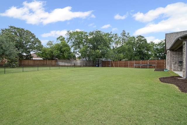 309 Red River Cir Trail, Highland Village, TX 75077 - fenced backyard with a trampoline