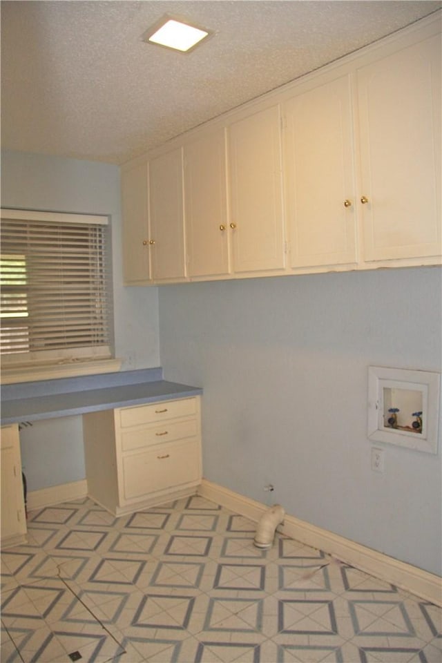 1612 Canyon Oaks Dr, Irving, TX 75061 - laundry room featuring cabinet space, washer hookup, a textured ceiling, and an office area