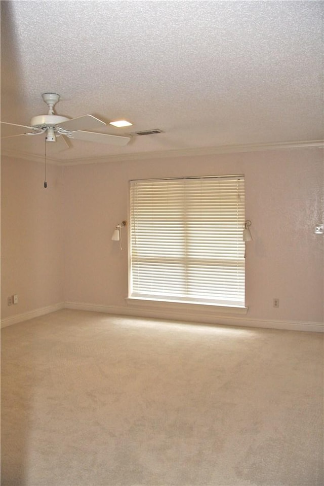 1612 Canyon Oaks Dr, Irving, TX 75061 - unfurnished room with a ceiling fan, a textured ceiling, light carpet, and ornamental molding