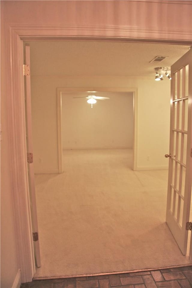 1612 Canyon Oaks Dr, Irving, TX 75061 - hallway with brick patterned flooring and carpet