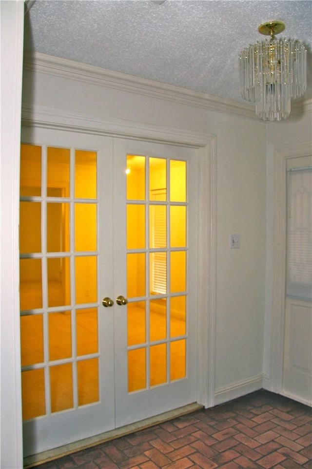 1612 Canyon Oaks Dr, Irving, TX 75061 - doorway to outside with french doors, a chandelier, brick floors, ornamental molding, and a textured ceiling
