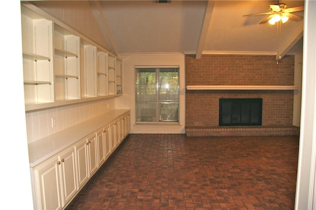 1612 Canyon Oaks Dr, Irving, TX 75061 - kitchen with light countertops, ceiling fan, open shelves, lofted ceiling, and a fireplace