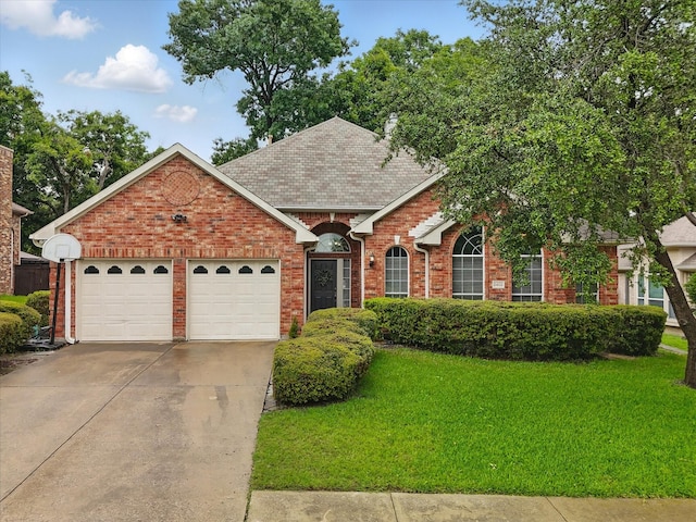 2402 Pittsburg Lndg, Mesquite, TX 75181 - view of front of house with an attached garage, a front yard, driveway, brick siding, and a shingled roof
