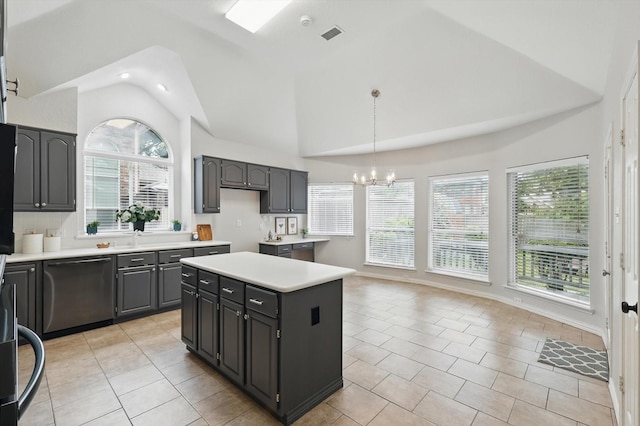 2402 Pittsburg Lndg, Mesquite, TX 75181 - kitchen with stainless steel dishwasher, a chandelier, light countertops, plenty of natural light, and high vaulted ceiling