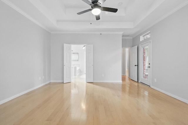 2402 Pittsburg Lndg, Mesquite, TX 75181 - unfurnished room featuring a raised ceiling, light wood finished floors, and ceiling fan