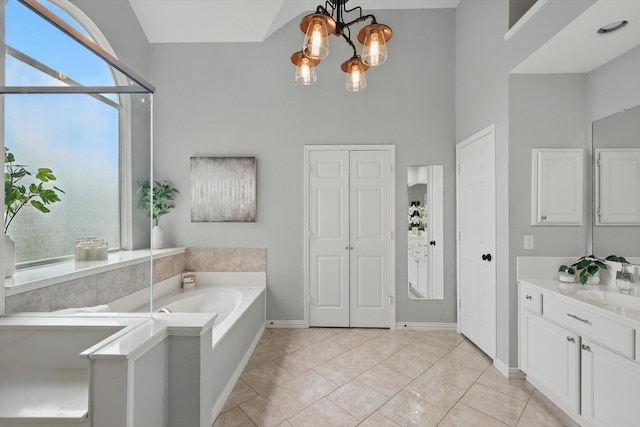 2402 Pittsburg Lndg, Mesquite, TX 75181 - full bath featuring a garden tub, vanity, and a chandelier
