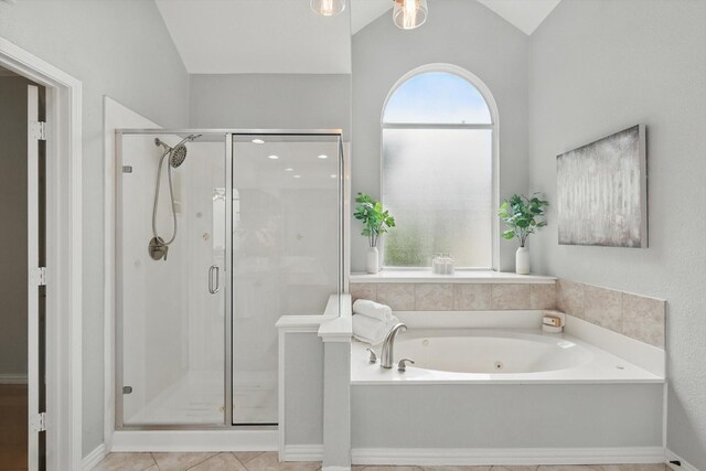 2402 Pittsburg Lndg, Mesquite, TX 75181 - bathroom with a garden tub, lofted ceiling, a stall shower, and tile patterned floors