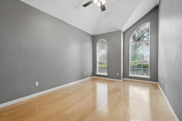 2402 Pittsburg Lndg, Mesquite, TX 75181 - empty room featuring ceiling fan, light wood finished floors, vaulted ceiling, and a textured wall