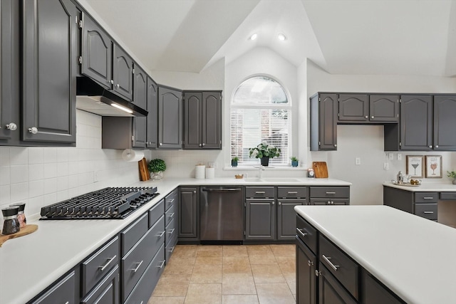 2402 Pittsburg Lndg, Mesquite, TX 75181 - kitchen with stainless steel dishwasher, black gas stovetop, lofted ceiling, under cabinet range hood, and tasteful backsplash