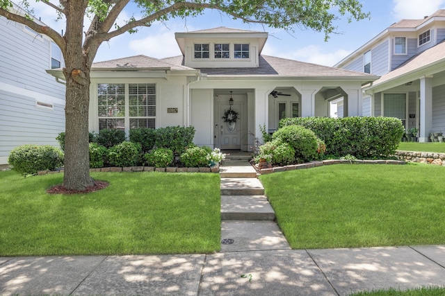 10917 Caldwell Ln, Fort Worth, TX 76179 - view of front of property featuring a front lawn, stucco siding, and a shingled roof