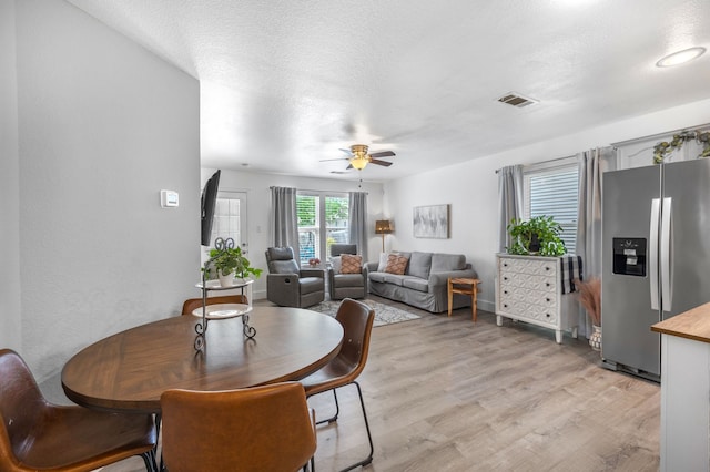 10917 Caldwell Ln, Fort Worth, TX 76179 - dining space with light wood finished floors and a ceiling fan