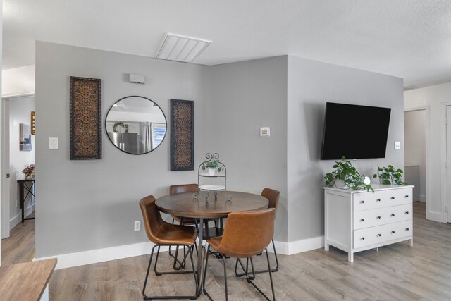 10917 Caldwell Ln, Fort Worth, TX 76179 - dining space featuring light wood-style floors and baseboards