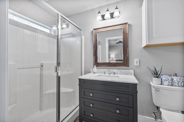 10917 Caldwell Ln, Fort Worth, TX 76179 - bathroom featuring vanity, a shower stall, and a textured wall