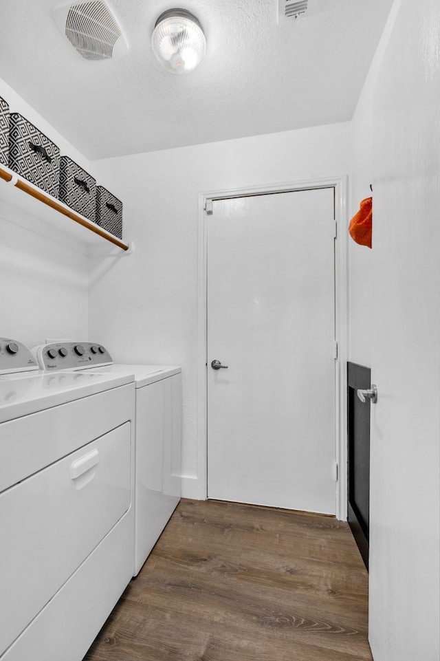 10917 Caldwell Ln, Fort Worth, TX 76179 - laundry area with washing machine and dryer and wood finished floors