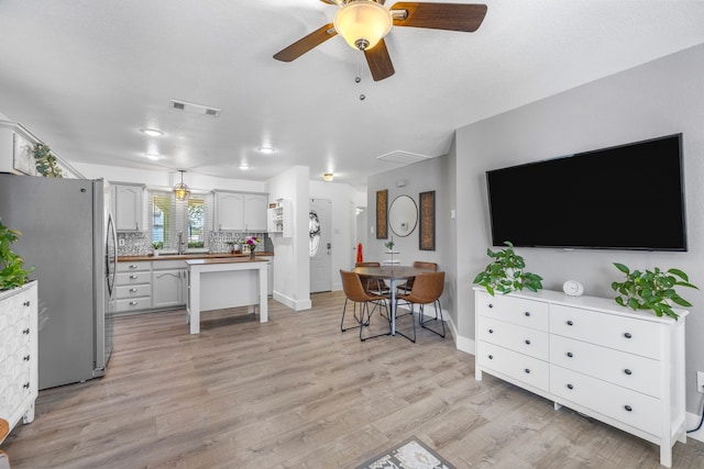 10917 Caldwell Ln, Fort Worth, TX 76179 - living area with light wood-type flooring and a ceiling fan