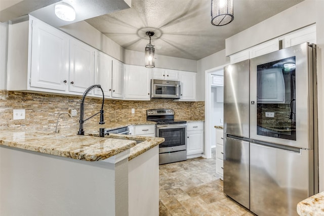 1614 Baltimore Dr, Richardson, TX 75081 - kitchen featuring stainless steel appliances, light stone counters, a peninsula, white cabinets, and backsplash