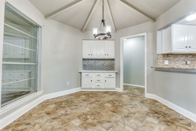 1614 Baltimore Dr, Richardson, TX 75081 - unfurnished dining area with a chandelier and stone finish floors