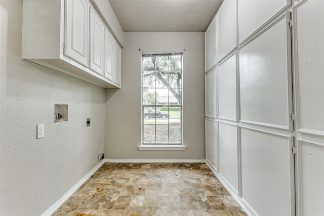 1614 Baltimore Dr, Richardson, TX 75081 - laundry room featuring cabinet space, electric dryer hookup, hookup for a washing machine, and stone finish flooring
