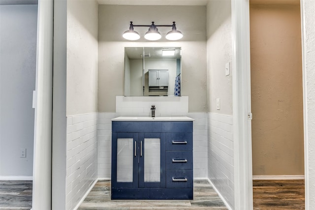 1614 Baltimore Dr, Richardson, TX 75081 - bathroom with wood finished floors and vanity