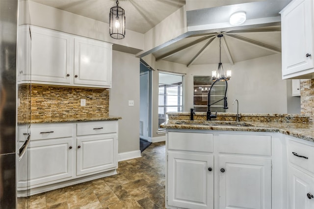 1614 Baltimore Dr, Richardson, TX 75081 - kitchen with white cabinets, decorative backsplash, a peninsula, and stone finish flooring