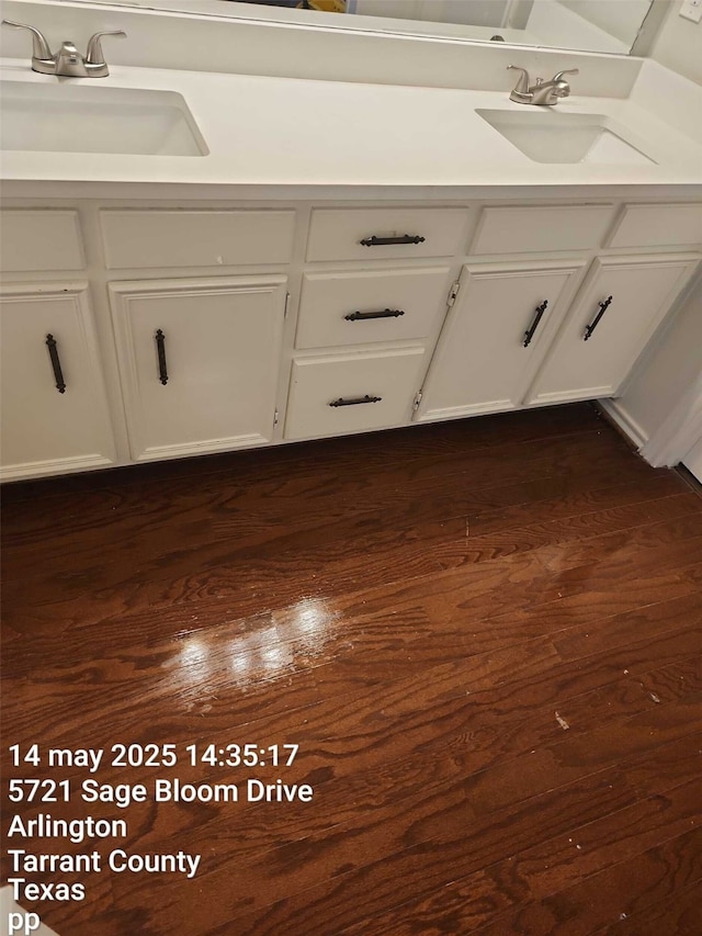 5722 Sagebrush Trl, Arlington, TX 76017 - bathroom featuring double vanity and wood finished floors