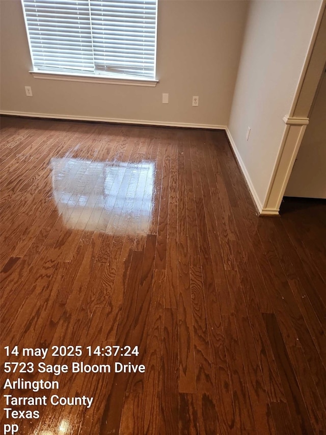 5722 Sagebrush Trl, Arlington, TX 76017 - unfurnished room with dark wood-style flooring and baseboards