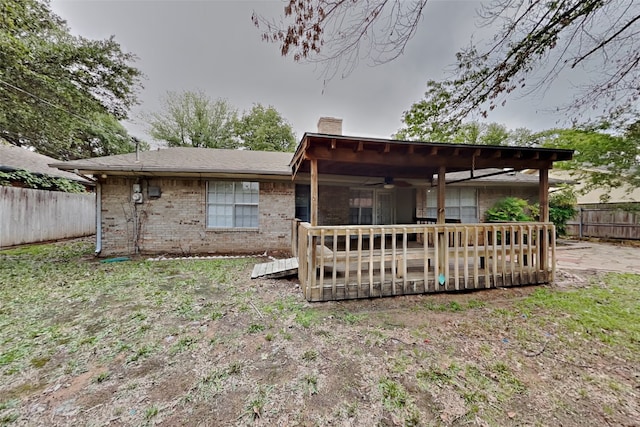 5722 Sagebrush Trl, Arlington, TX 76017 - rear view of property featuring a ceiling fan, a chimney, a fenced backyard, a wooden deck, and brick siding