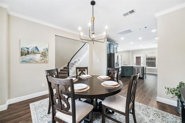 4270 Crooked Stick Dr, Frisco, TX 75035 - dining area with a chandelier, dark wood-type flooring, stairway, recessed lighting, and ornamental molding