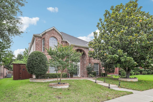8729 Somerville Way, Plano, TX 75025 - traditional home with brick siding, a front lawn, and a shingled roof