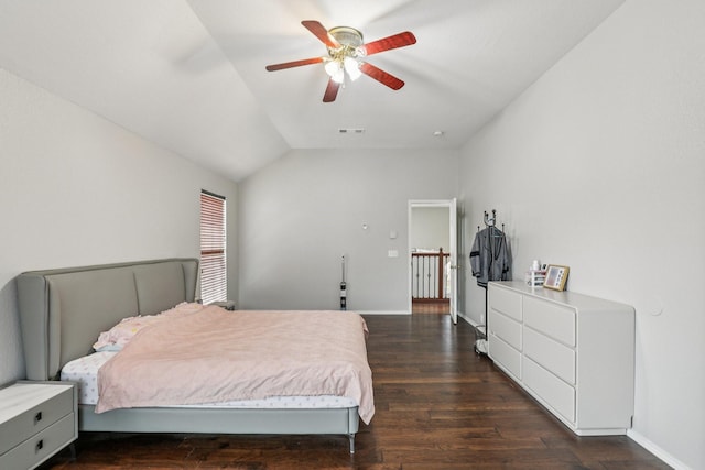 8729 Somerville Way, Plano, TX 75025 - bedroom featuring dark wood-style floors, vaulted ceiling, and a ceiling fan