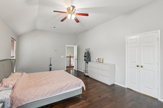 8729 Somerville Way, Plano, TX 75025 - bedroom with dark wood-style flooring, vaulted ceiling, and a ceiling fan