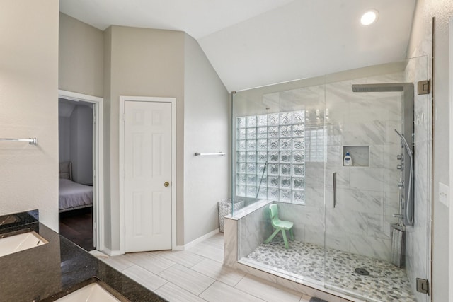 8729 Somerville Way, Plano, TX 75025 - bathroom with a shower stall, vaulted ceiling, and connected bathroom