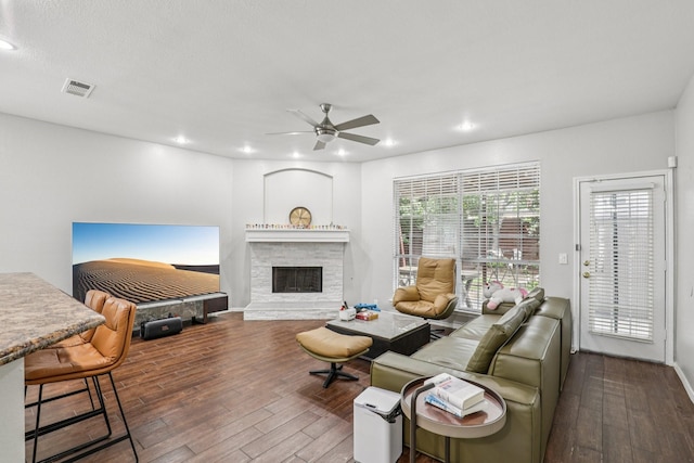 8729 Somerville Way, Plano, TX 75025 - living room featuring hardwood / wood-style floors, a ceiling fan, recessed lighting, and a stone fireplace