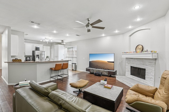 8729 Somerville Way, Plano, TX 75025 - living area with a ceiling fan, recessed lighting, dark wood-style floors, and a fireplace