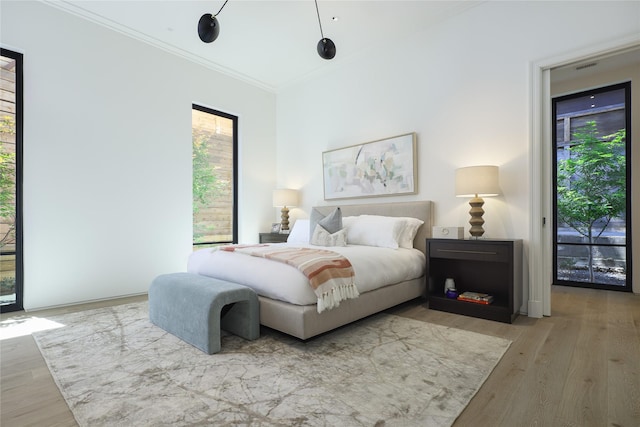 3626 Edgewater St, Dallas, TX 75205 - bedroom with multiple windows, wood finished floors, ornamental molding, and access to outside