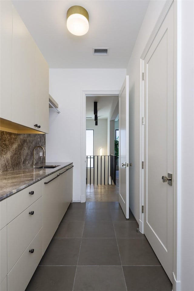 3626 Edgewater St, Dallas, TX 75205 - laundry room with a sink and dark tile patterned floors