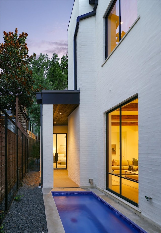 3626 Edgewater St, Dallas, TX 75205 - back of house at dusk with brick siding