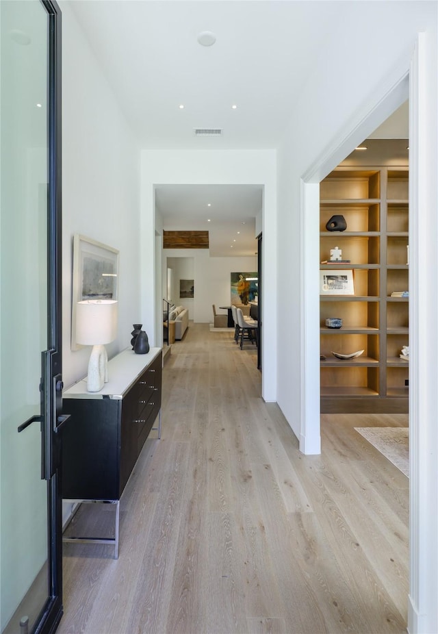 3626 Edgewater St, Dallas, TX 75205 - hallway featuring light wood-style flooring and built in shelves