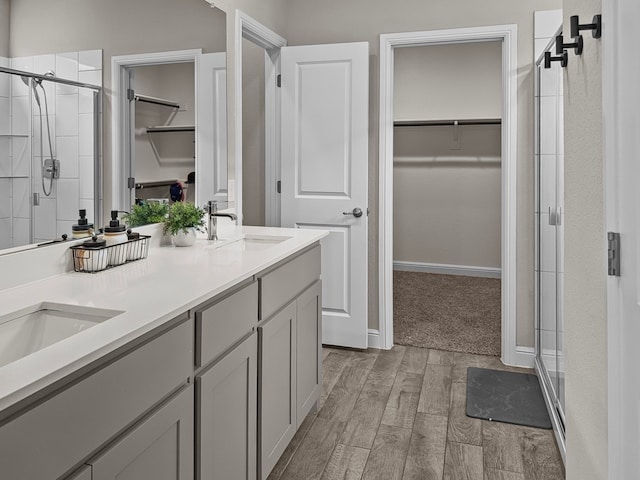 200 Tanager Dr, Rhome, TX 76078 - full bath featuring a walk in closet, a stall shower, double vanity, and wood finished floors
