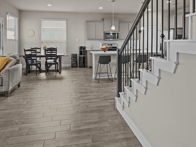 200 Tanager Dr, Rhome, TX 76078 - dining room featuring wood finished floors, recessed lighting, and stairs