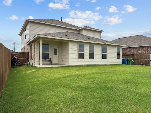 200 Tanager Dr, Rhome, TX 76078 - rear view of property featuring a fenced backyard, a patio area, and roof with shingles