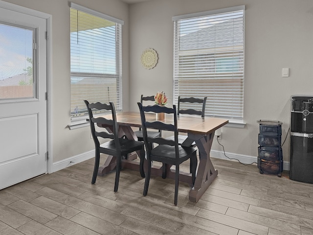 200 Tanager Dr, Rhome, TX 76078 - dining area featuring wood finished floors and healthy amount of natural light