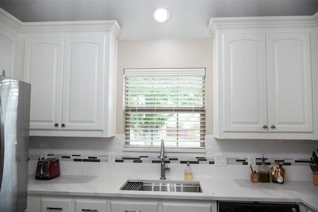 305 Shepherd Ln, Royse City, TX 75189 - kitchen featuring dishwasher, white cabinetry, decorative backsplash, and freestanding refrigerator