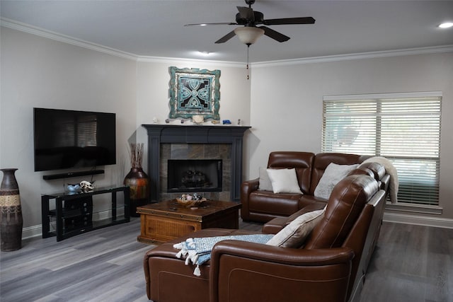 305 Shepherd Ln, Royse City, TX 75189 - living area featuring crown molding, wood finished floors, a ceiling fan, and a tile fireplace