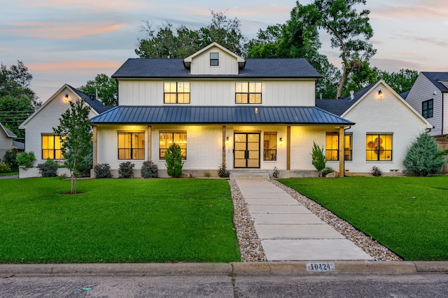 10424 Remington Ln, Dallas, TX 75229 - modern farmhouse featuring a standing seam roof, a metal roof, covered porch, and a yard