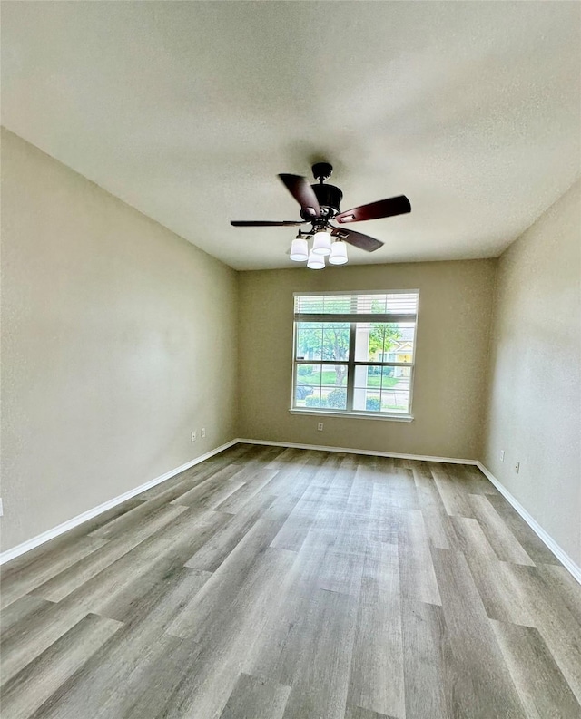 1736 Goodwin Dr, Providence Village, TX 76227 - empty room featuring wood finished floors, a ceiling fan, and a textured ceiling