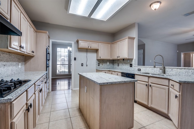 1403 Bosher Dr, Cedar Hill, TX 75104 - kitchen with black gas stovetop, a center island, tasteful backsplash, and light tile patterned floors